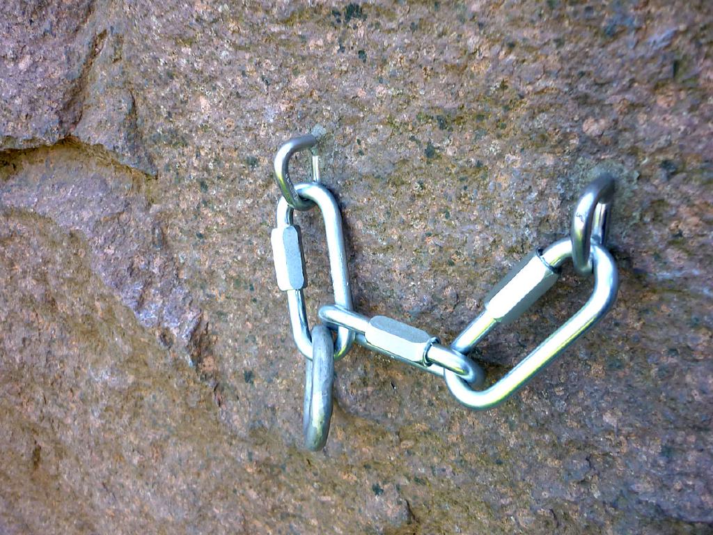 Two bolts well set in the rock, connected together with Mallions, and finally a large ring
