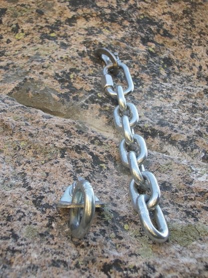 Two sharp hangers, one with a big ring and the other with a long chain